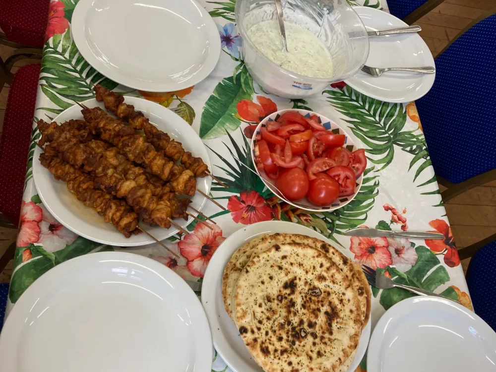 A colourful shared table prepared for a Cook and Chill session